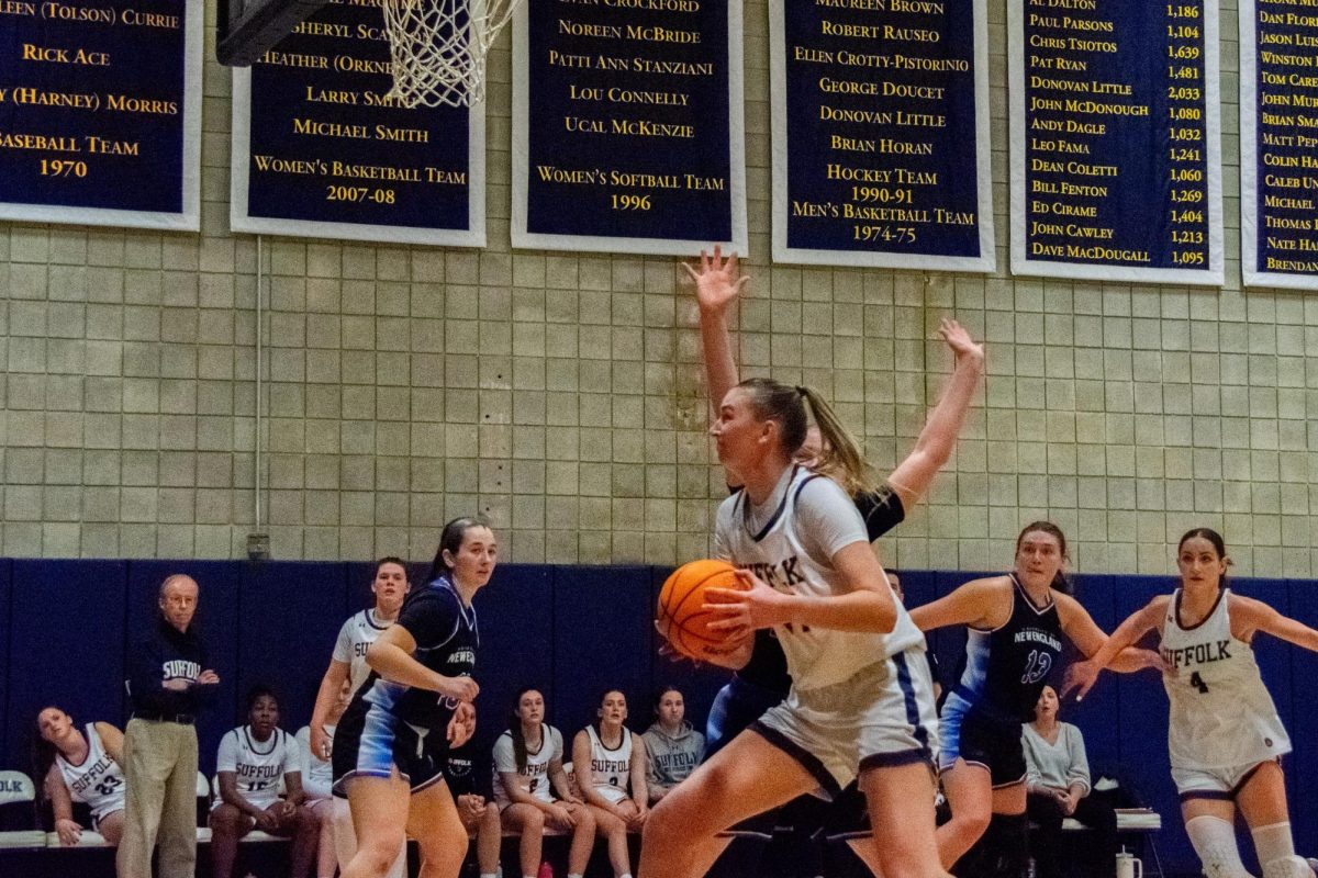 Graduate+forward+Lauren+Romito+cuts+to+the+hoop+during+womens+basketballs+victory+against+Endicott+College+Feb.+20.