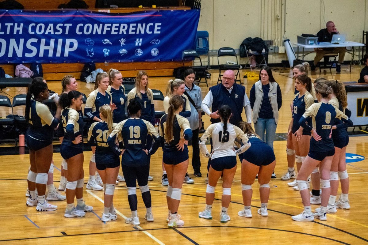 Suffolk+volleyball%2Fmens+tennis+head+coach+Scott+Blanchard+addresses+the+volleyball+team+during+a+timeout+in+the+CCC+Semifinals+against+the+Wentworth+Institute+of+Technology+Nov.+9.