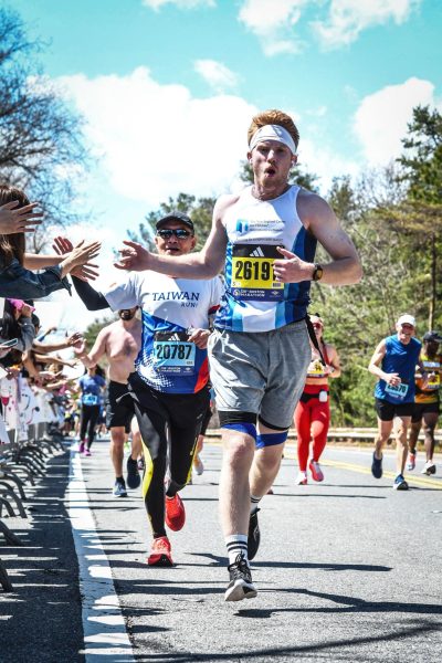 Suffolk University senior Oliver Ferrari running the 2024 Boston Marathon. He finished in four hours, 36 minutes and 38 seconds.