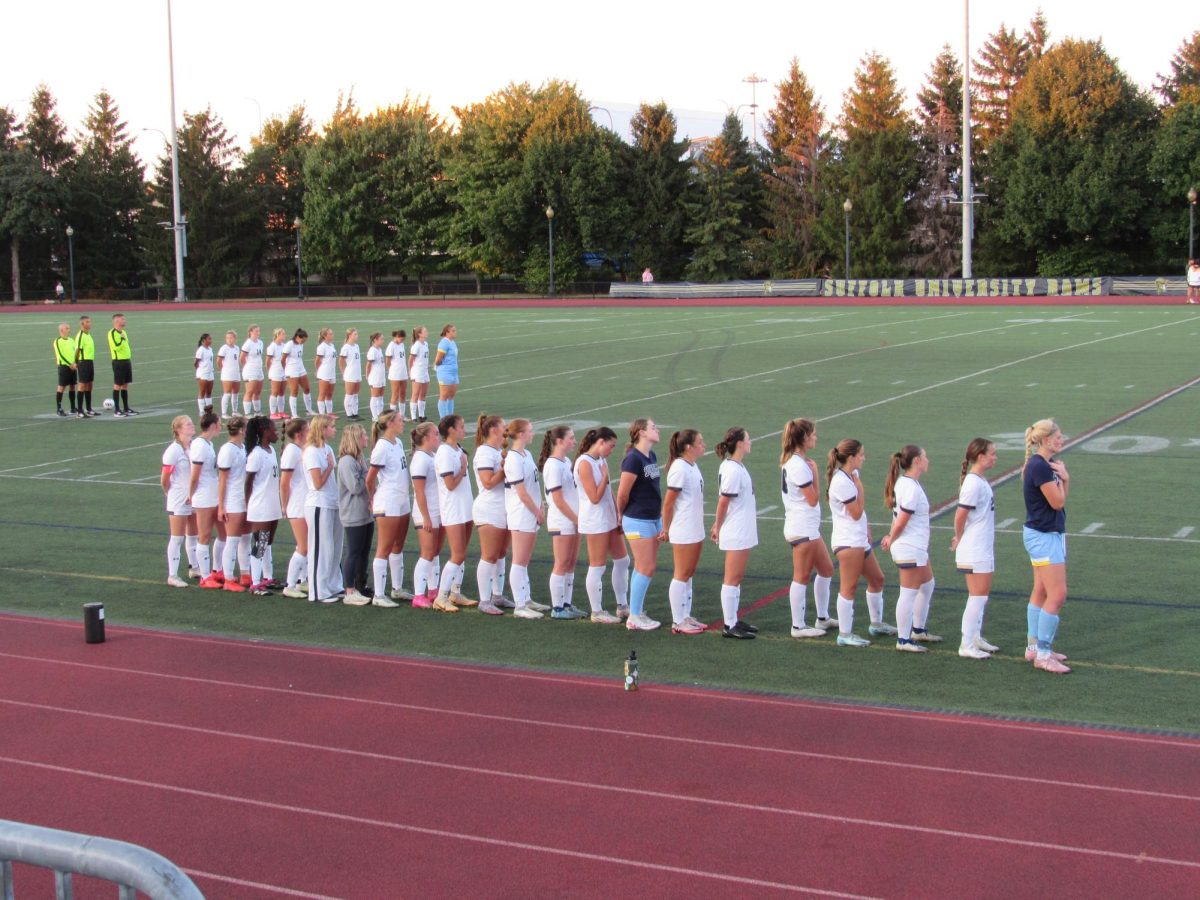 Suffolk women's soccer team lined up for the national anthem ahead of their game vs UMass Dartmouth Sept. 3.