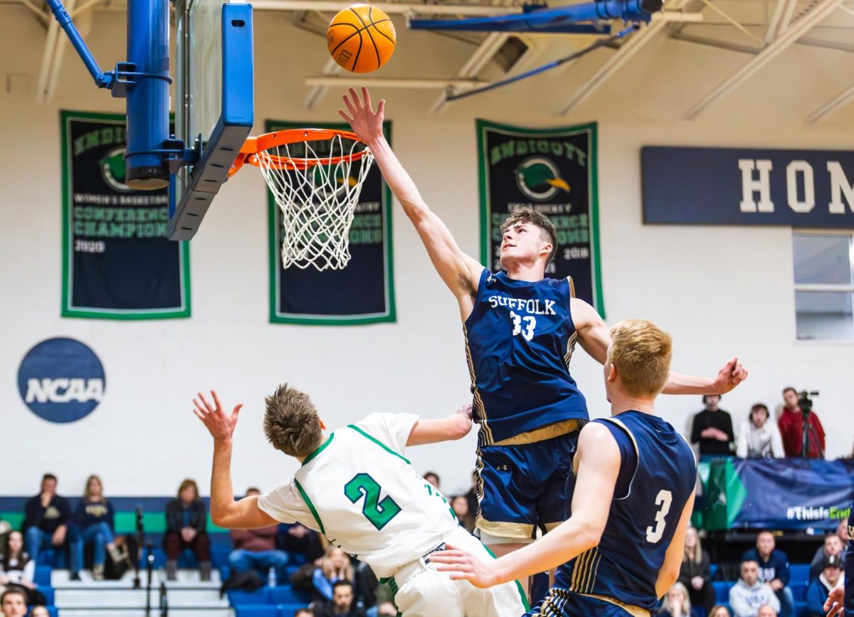 Jake Gomez attempts a layup during the Commonwealth Coast Playoffs first round against Endicott College Feb. 20 (courtesy of Suffolk University Athletics).