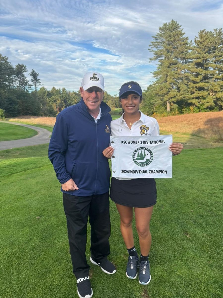 Krisna Mahendran poses with head coach Jay Parker after winning the Keene State Invitational Sept. 29 (courtesy of Mahendran).