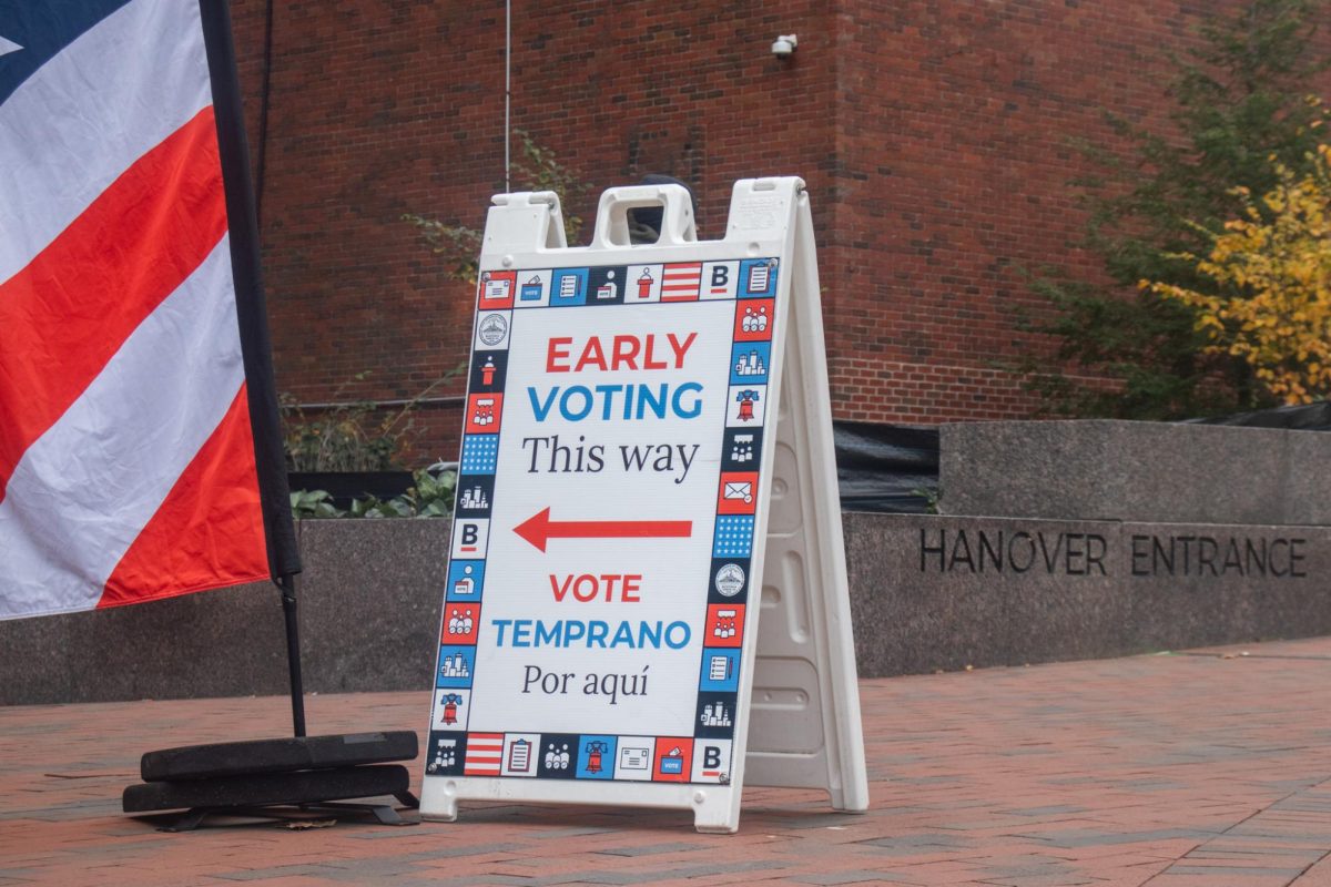 A sign for early voting outside Boston City Hall.