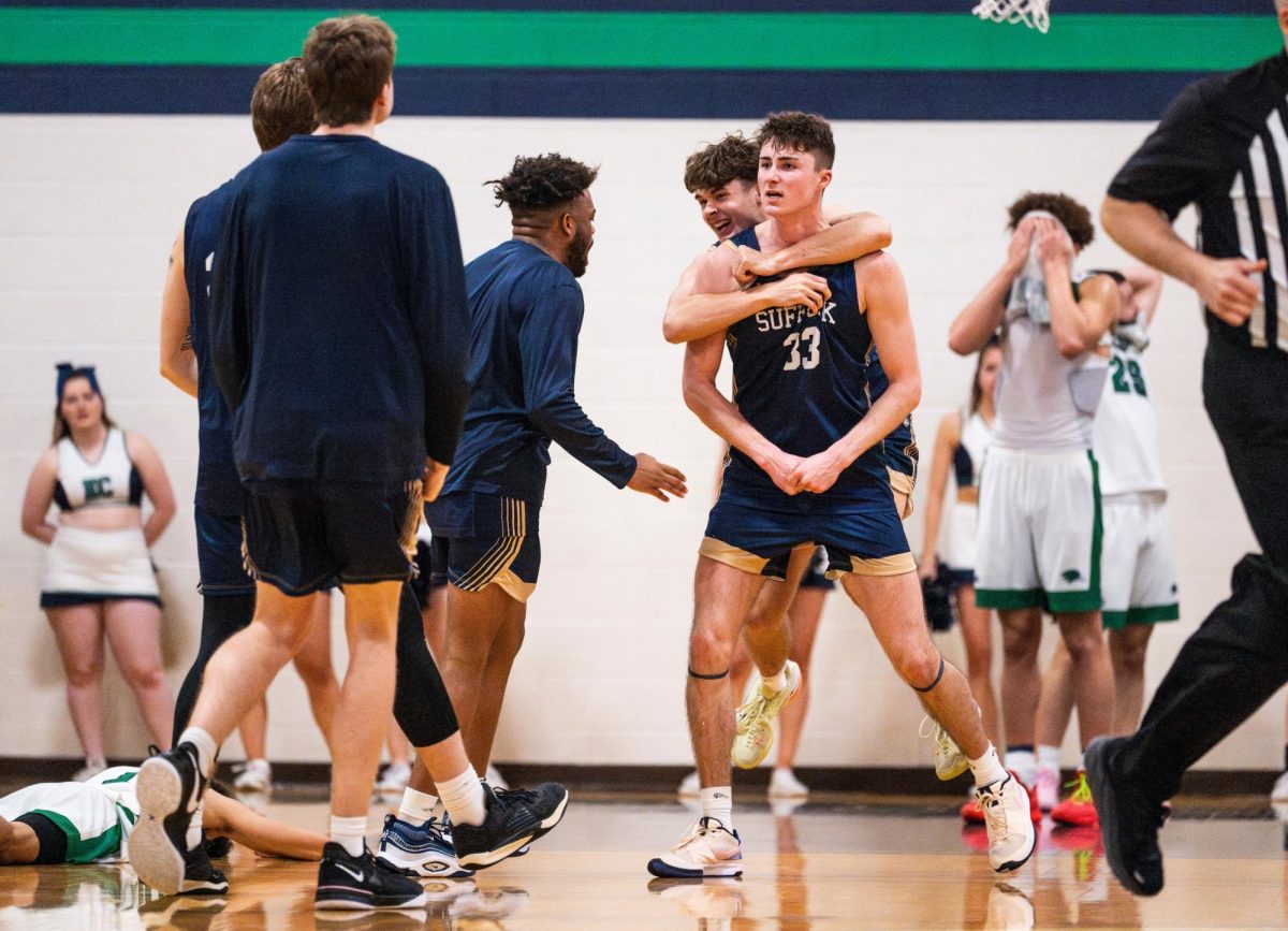 Senior forward Jake Gomez celebrates with his teammates during a game against Endicott (courtesy of Suffolk Athletics)