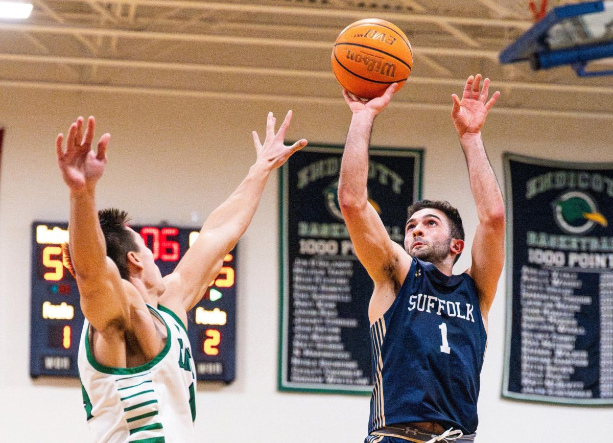 Guard Danny Yardemian jumps for a shot in the first round of the Commonwealth Coast Playoffs against Endicott College Feb. 20 (courtesy of Suffolk University athletics).