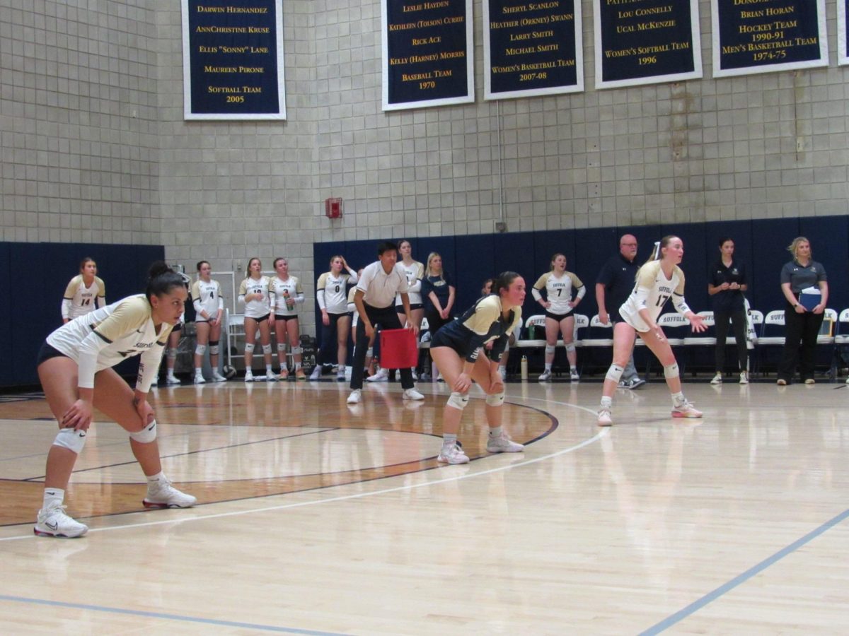 Chloe Clement, Morgan Kelsey and McKenna Keowen waiting for a serve in volleyball’s first round playoff matchup.