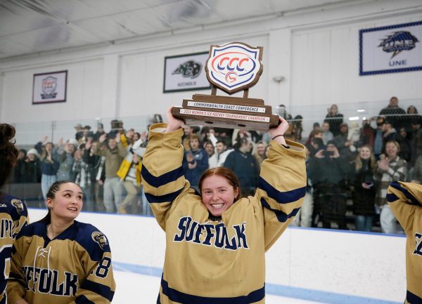 Goaltender Lily O'Neil holding the CCC championship trophy in 2023 (courtesy of Vanessa Stuart).