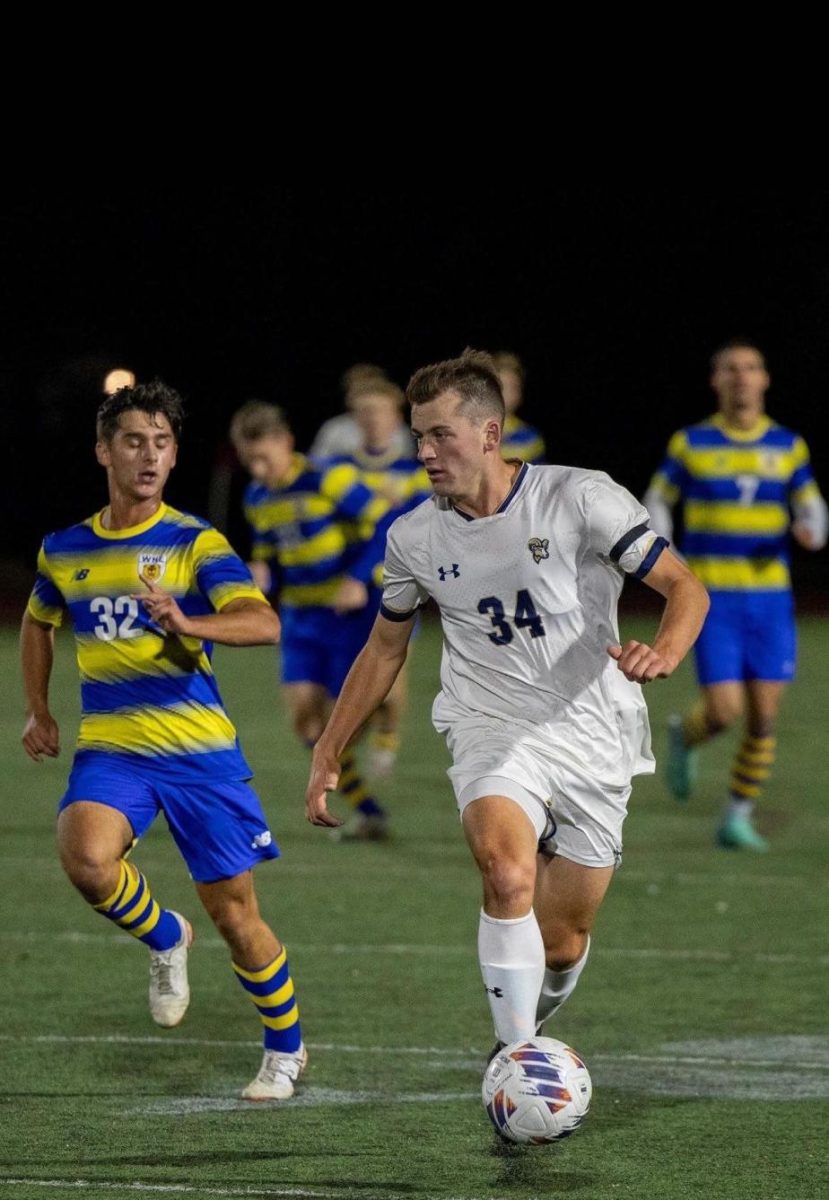 Midfielder Dan Colbert handles the ball against Western New England University in the Conference of New England semifinals Nov. 6. (courtesy of Dan Colbert)