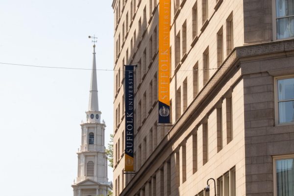 Suffolk University's academic and administrative building at 73 Tremont St. Suffolk laid off 35 staff members this summer.