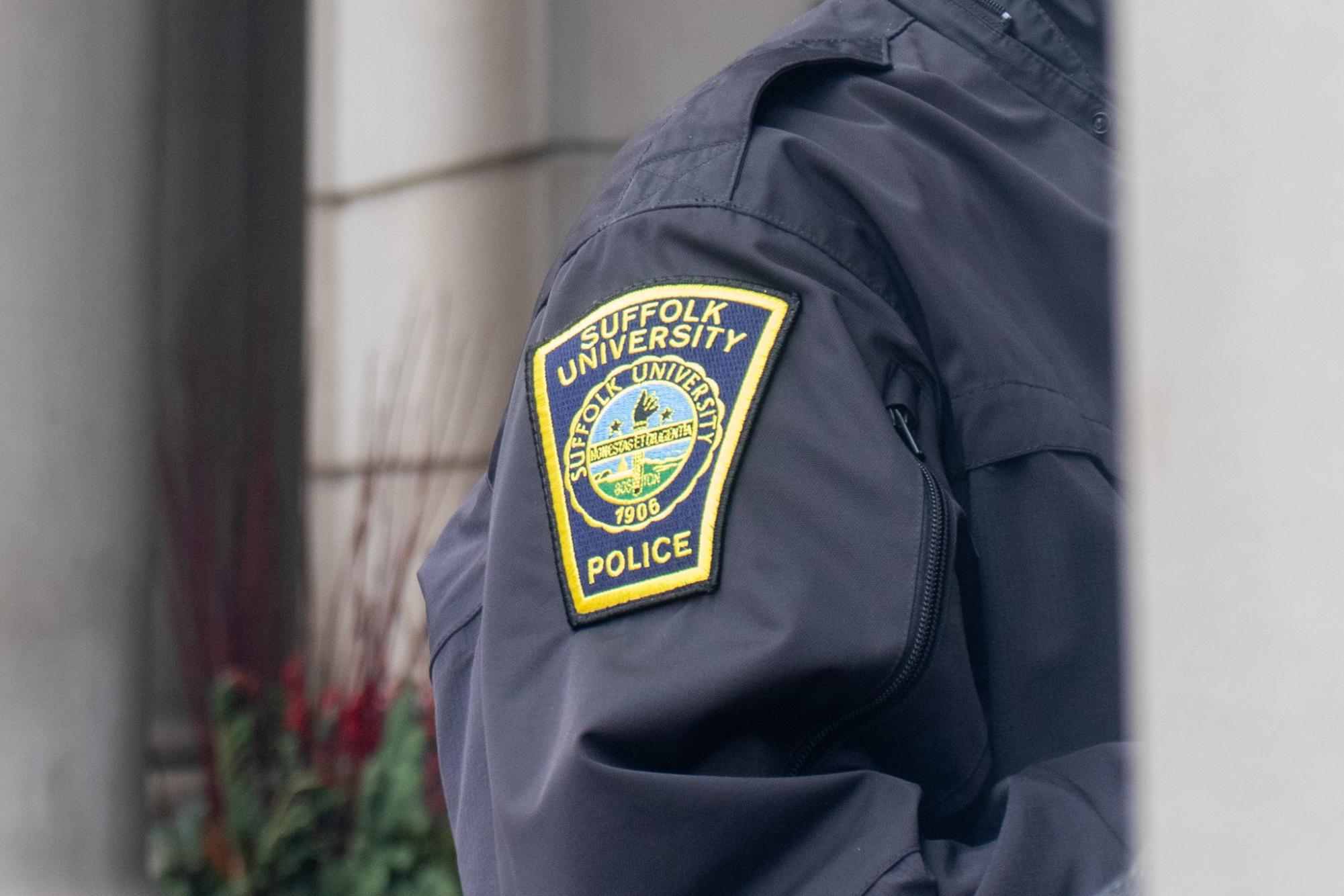 A Suffolk University police officer outside Sargent Hall.