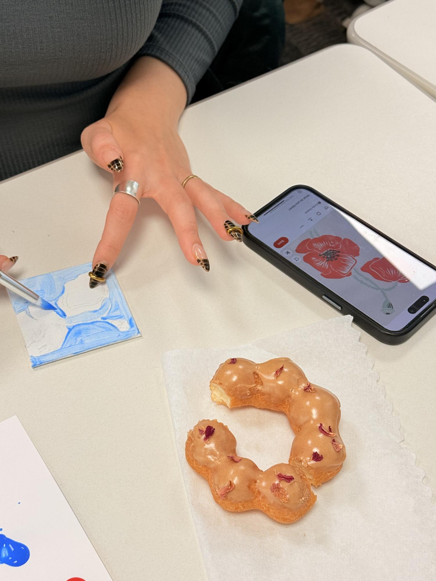 Students participating in the club's first meeting of crafting and enjoying mochi donuts.