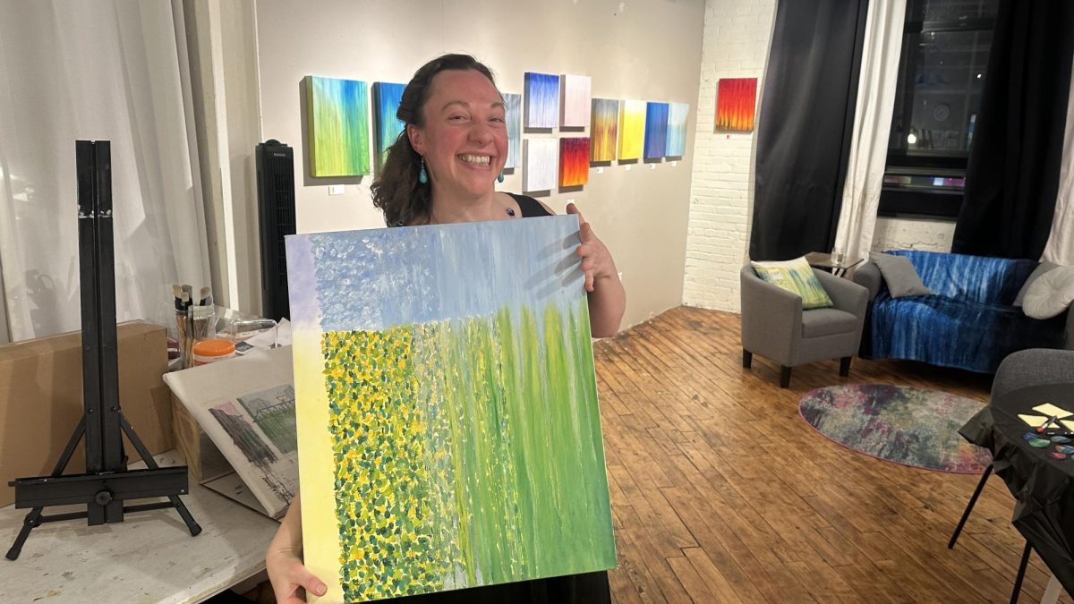 Rachel Brask showcasing her artwork in her SoWa studio.