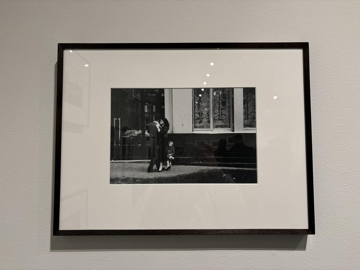 Two strangers and a child photographed by Robert Frank.