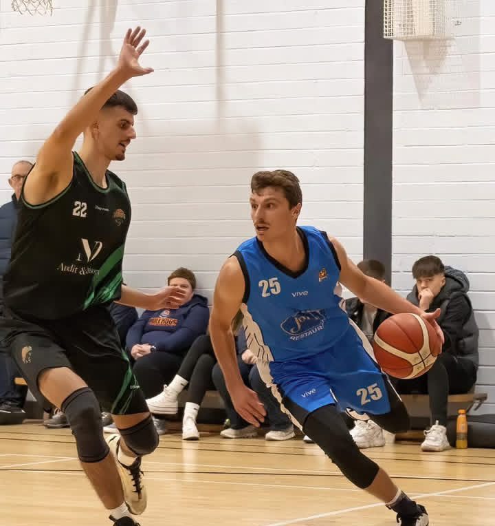 Evan Cook (right) controls the ball during a game (courtesy of Evan Cook)