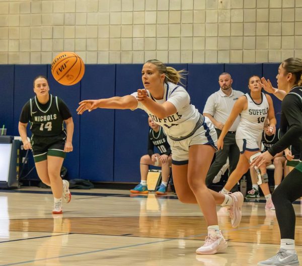 Forward Aisling Crowley making a pass during a game against Nichols College Feb. 22 (courtesy of Sophia DiNanno).