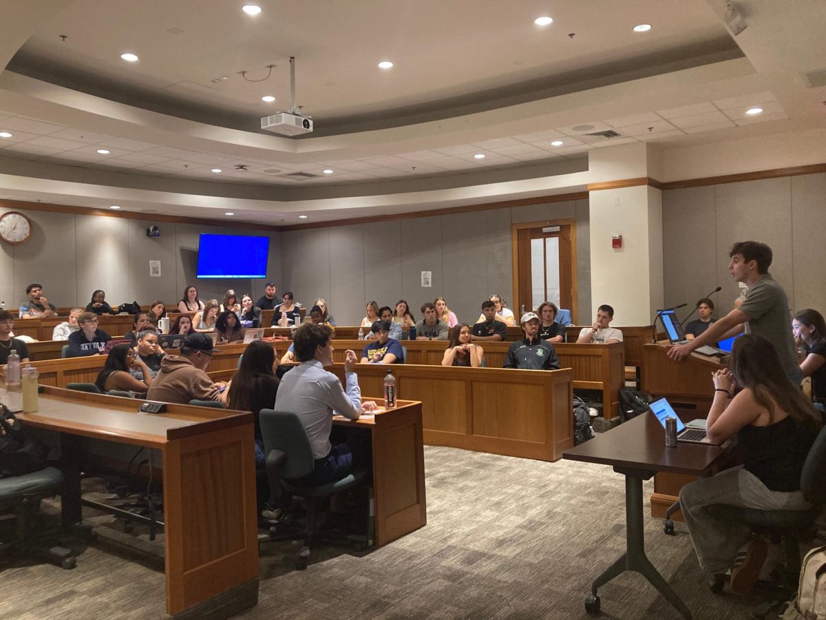 SGA President Charlie Reyna-Demes addressing the student body