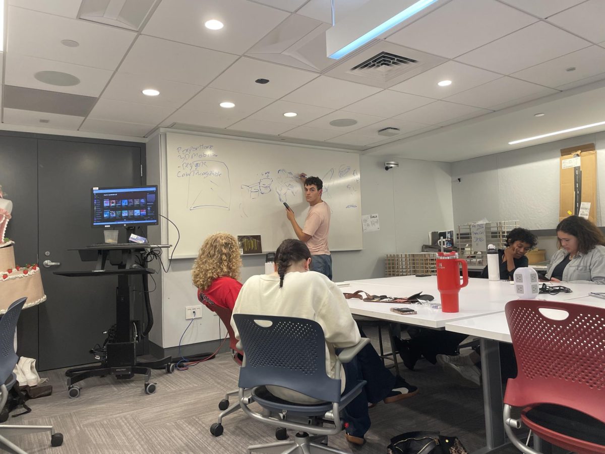 Club President Toby Lage conducting meeting in new art studio space. 