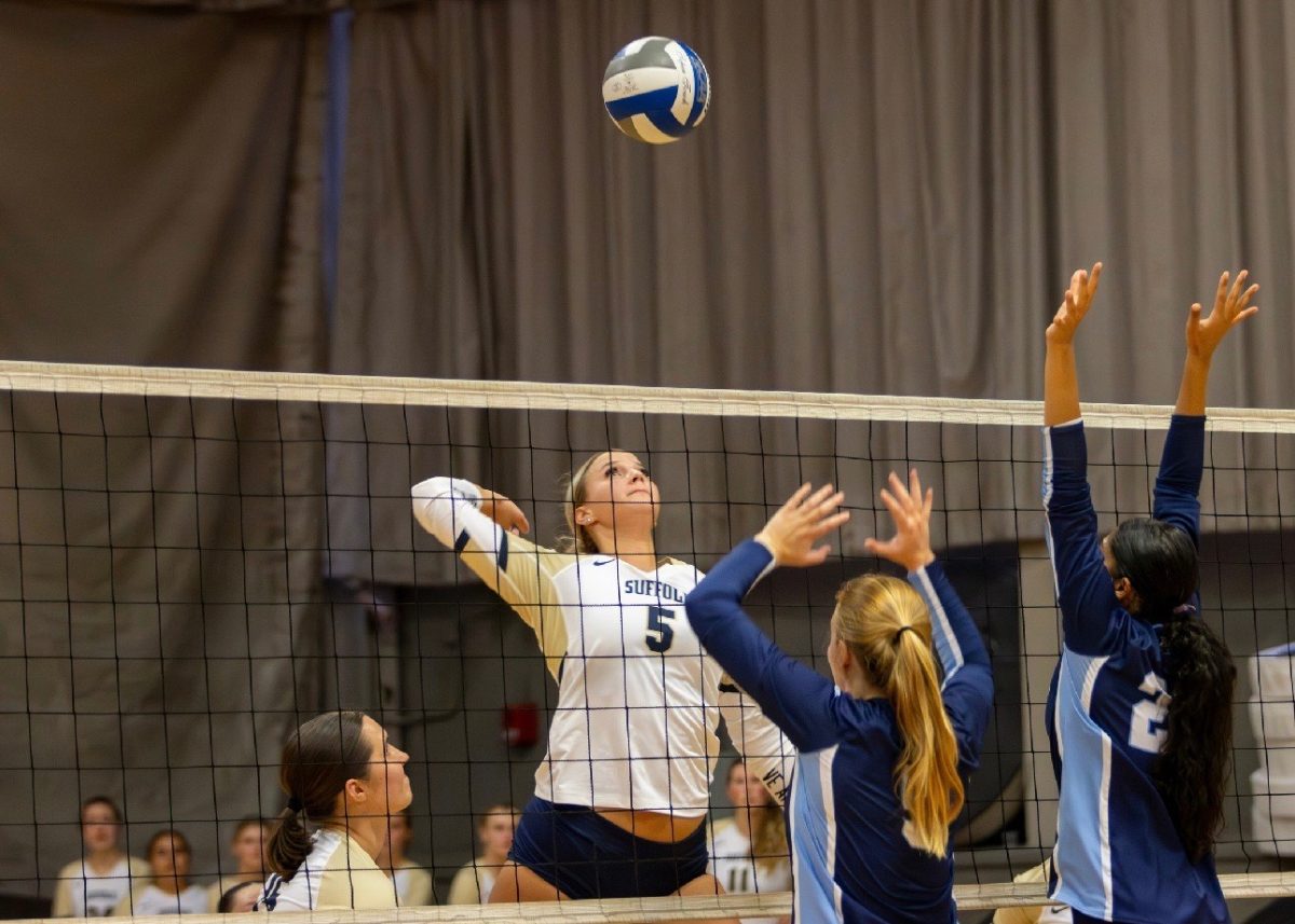 Grace Cervenka rising to hit the ball (courtesy of Grace Cervenka).