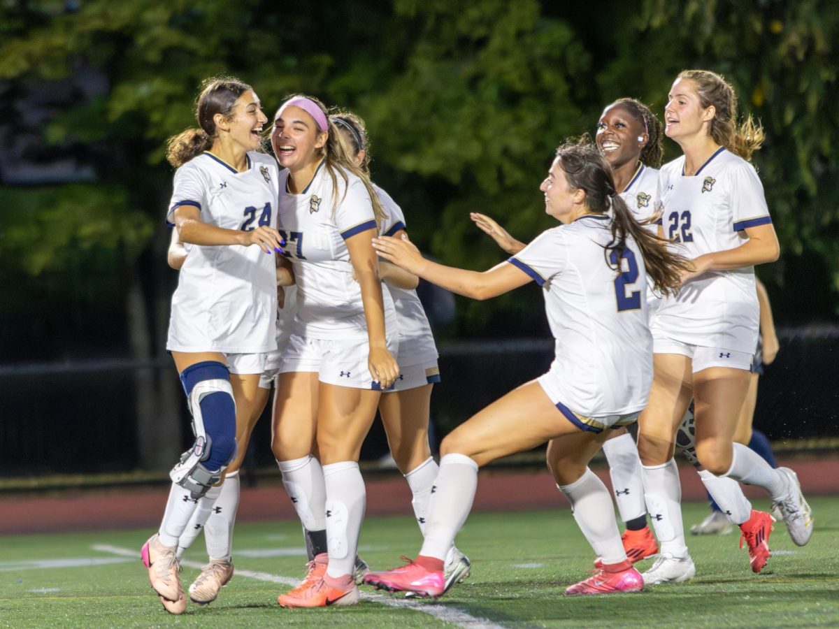 The Suffolk women's soccer team celebrates after scoring a goal during their 5-0 win against Rivier University Sept. 9.