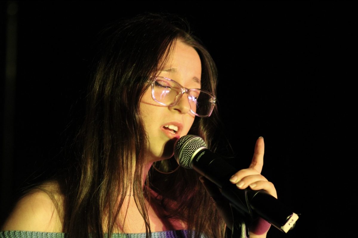 Suffolk student Claudia Desrosiens performing at Open Mic Night on Oct. 2.