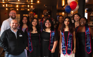 Graduated McNair Scholars with their stoles and advisors. (courtesy of Bryan Langren)