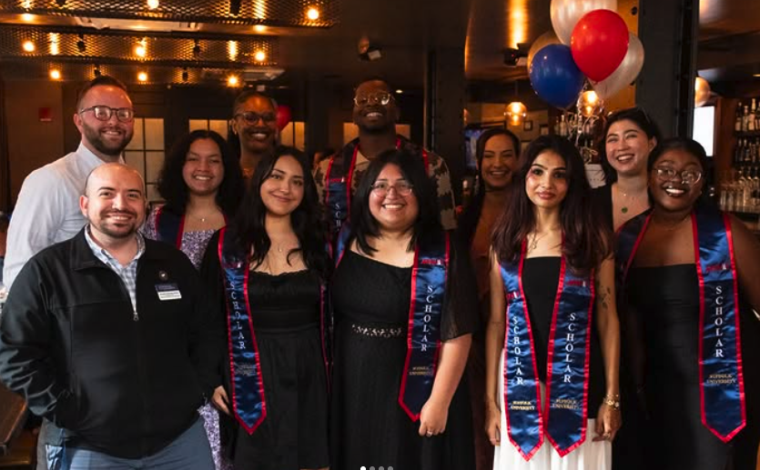 Graduated McNair Scholars with their stoles and advisors. (courtesy of Bryan Langren)