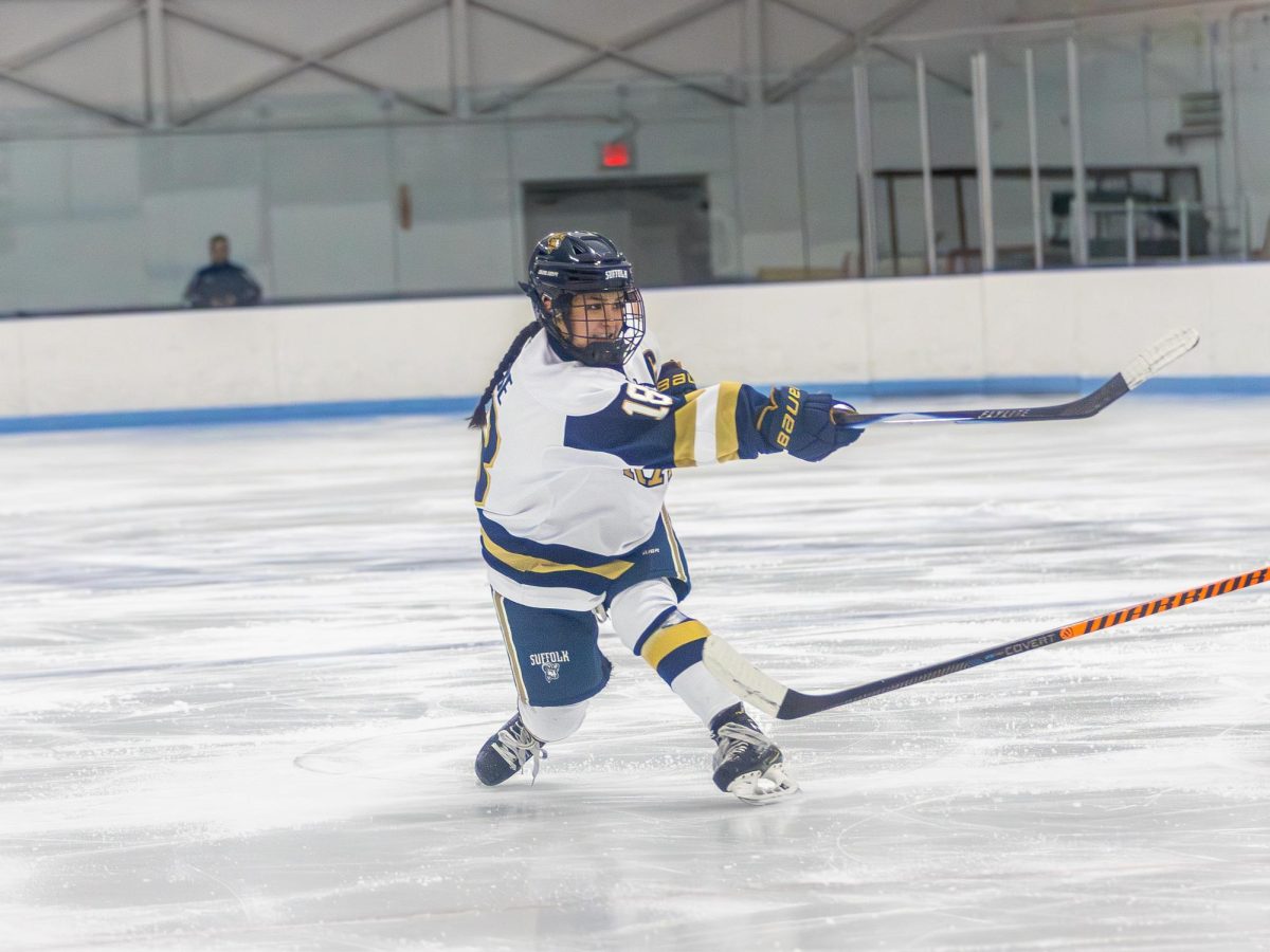 Senior Captain Liliana Moose attempts a shot during a 5-3 loss to Trinity College Nov. 29.