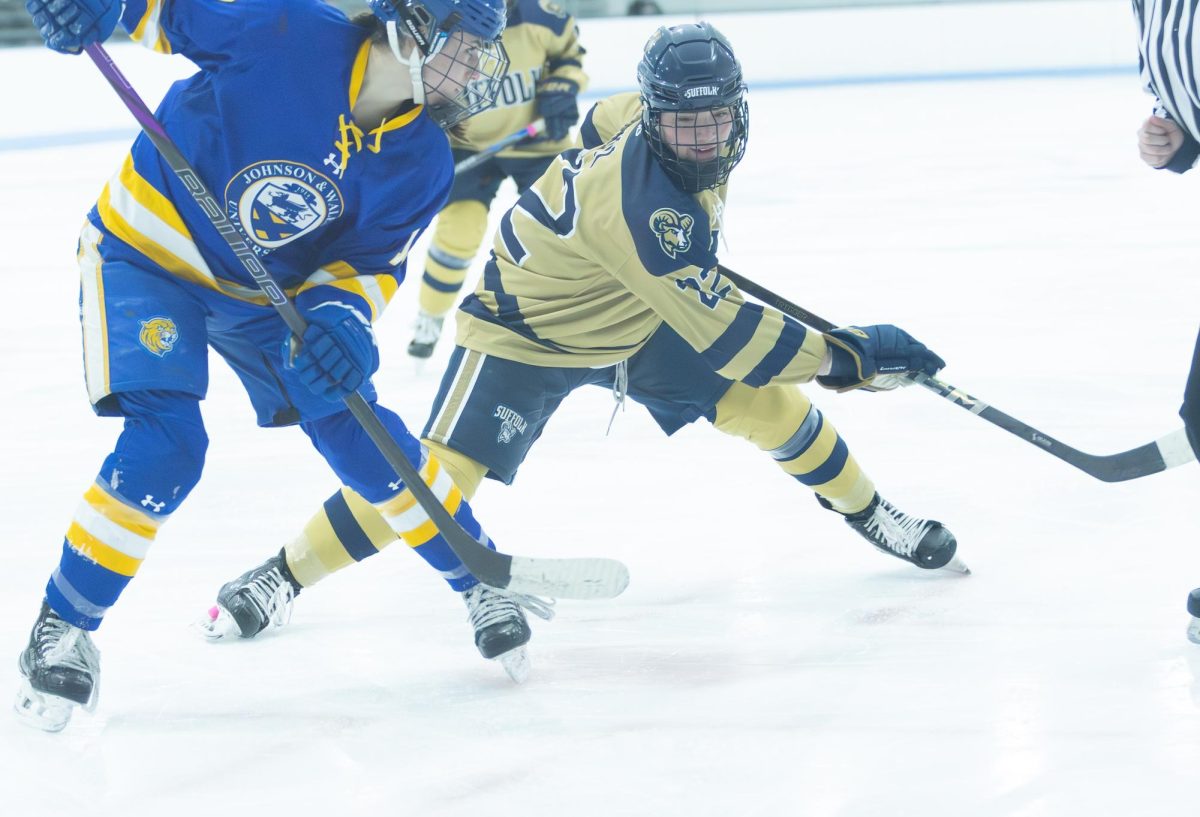 Alexia Hill battling in a faceoff during a game against Johnson & Wales University Jan. 23.
