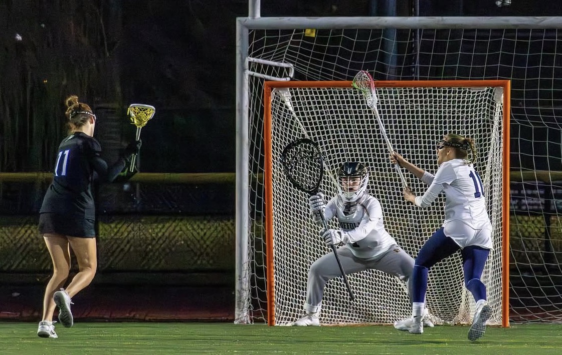 Goalie Charlotte Guziejka prepares to stop a shot during a game against the University of New England.