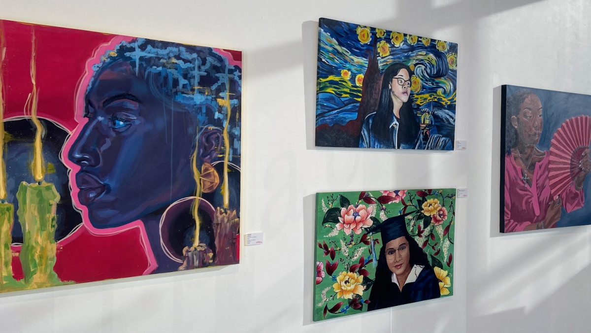 Portraits on display at 'Artists of Tomorrow' with 'Inflame' by Hannah on the far left.