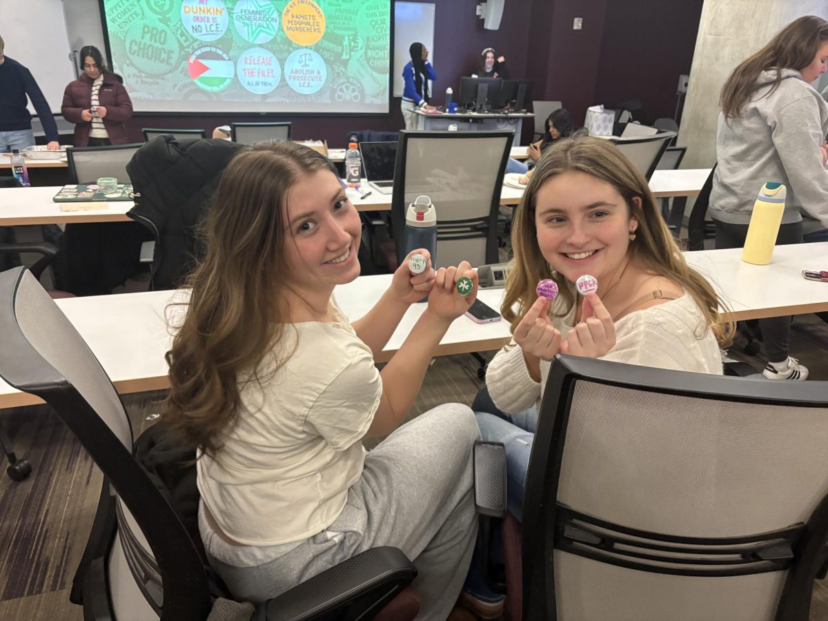 Sophomores Aileen Macdonnel and Ava Schumacher making their own pins.