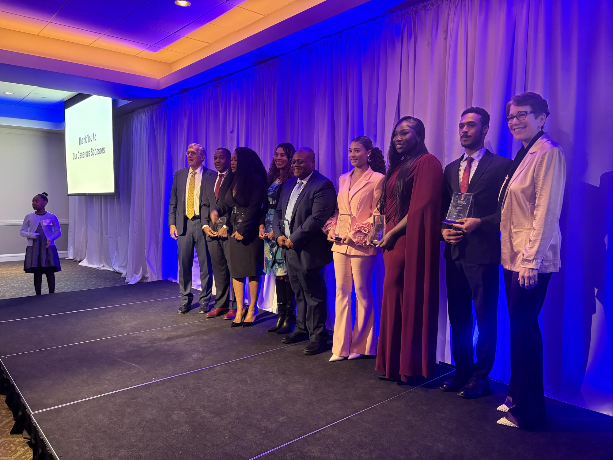 Black Excellence award recipients standing together at the 2026 ceremony.