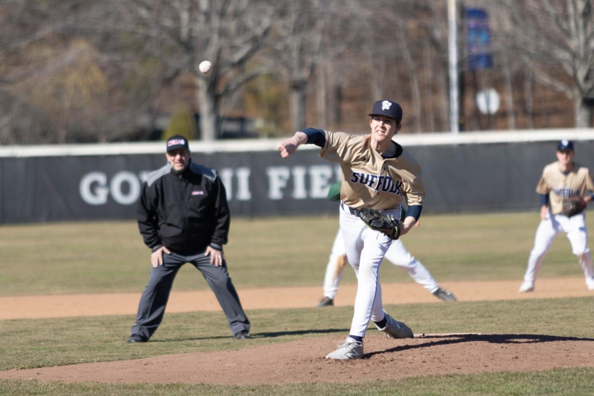 Colin McNeal throwing a pitch during a 12-1 loss against Babson College March 25.