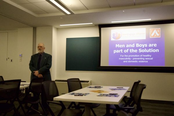 Activist Craig Norberg-Bohm presenting for Suffolk's Our Bodies Ourselves event.
