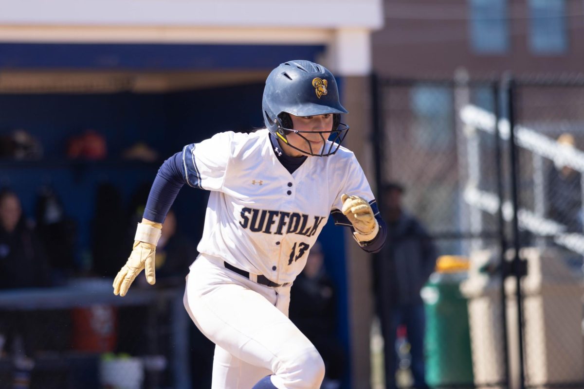 Roma Braid running down the baseline during a March 29 doubleheader against Johnson & Wales University.